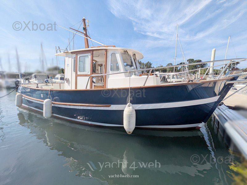 Rhea 750 timonier barco de motor